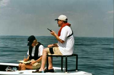 A man testing his radio on the water.