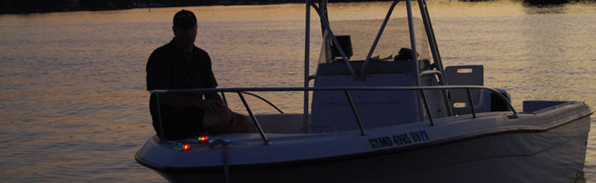 a man on a boat with navigation lights visible