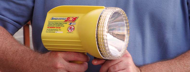 A tester is holding an electroniv distress signal flash light