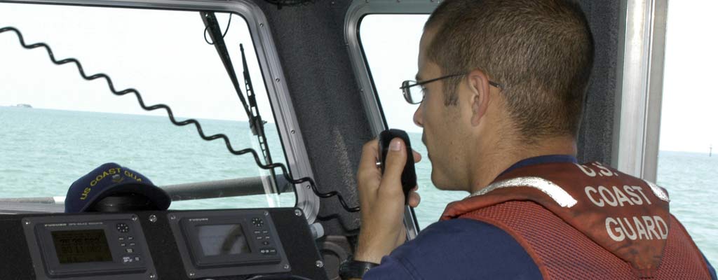 a coast guard captain answers his radio