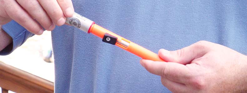 a man holding a small flare