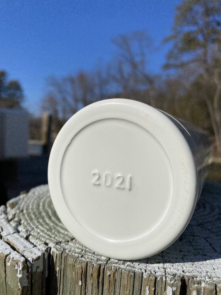 The bottom of a fire extinguisher shows its year of production.