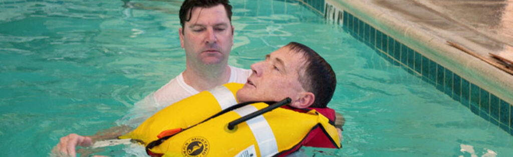 A man floats in a pool with an inflatable life jacket